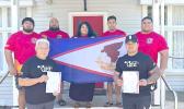 The five‑member team representing the American Samoa Powerlifting Federation 