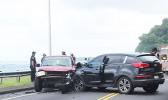 two cars at side of road with damage