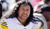 In this Oct. 12, 2014, file photo, Pittsburgh Steelers strong safety Troy Polamalu watches from the bench in the second quarter of an NFL football game against the Cleveland Brownsin Cleveland. First-time eligibles Reggie Wayne and Polamalu are among 15 finalists for the Pro Football Hall of Fame's modern-day 2020 class. (AP Photo/David Richard, File)
