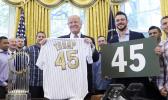 President Donald Trump with Chicago Cubs third baseman Kris Bryant in June. (AP Photo/Susan Walsh, File) President Donald Trump with Chicago Cubs third baseman Kris Bryant in June. (AP Photo/Susan Walsh, File)