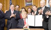 US President Donald Trump holds up the executive order he signed yesterday at the Interior Department building in Washington D.C. that calls for a review of the federal Antiquities Act. Right behind Trump is Congresswoman Aumua Amata, who was invited along with other Congressional members to attend the signing ceremony. Review includes the Rose Atoll of American Samoa and the Pacific Remote Islands marine monuments. Amata has called for the review of these monument designations due to their effect on the te