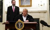 President Donald Trump signs an $8.3 billion bill to fight the coronavirus