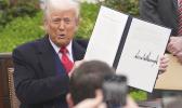 President Donald Trump holds a signed executive order during an event to announce new tariffs in the Rose Garden of the White House, Wednesday, April 2, 2025, in Washington. (AP Photo/Evan Vucci) President Donald Trump holds a signed executive order