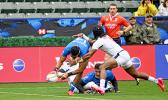 Tuna Tuitama goes over the top of Kevon Williams