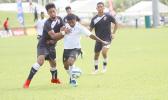 Ueli Tualaulelei (left) of American Samoa defends