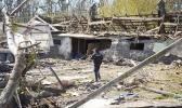 A police officer inspects a destroyed area following a Russian missiles attack on Thursday in Fastov, south of Kyiv, Ukraine, Friday, April 29, 2022. (AP Photo/Efrem Lukatsky) A destroyed area in Kyiv, Ukraine
