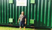 In this Samoa News file photo, Su’a Alexander Eli Jennings outside of the retrofitted freight container back in October 2015, where raw ulu will be processed and dried to be milled into gluten free, low glycemic index flour. The container operates on solar panels to provide renewable energy for the retrofitted container.   [Photo: JL]