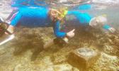 Dr. Charles Birkeland and Dr. Alison Green at the Aua Transect underwater marker. The Aua Village Transect project — the oldest survey of a coral reef in the world — celebrated its 100th anniversary last week. [photo: courtesy]