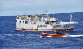 USCG boarding crew heading toward a foreigh vessel