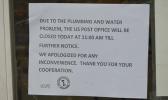 Photo of sign on door at USPS saying it would be closed TFN after plumbing problems discovered