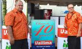 Latu Kupu and Afa Young showing off “Vailima, Samoa’s Own Beer” special signage