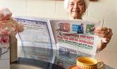 Vera Annesley reading the paper