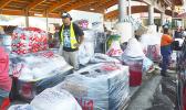 Man with large amount of cargo to load on MV Lady Naomi