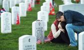 Victoria Ferguson is comforted by her husband, Phillip Ferguson, at the grave of her brother, David Taylor Miller, at Arlington National Cemetery on Nov. 11, 2015. Miller, who was killed in Afghanistan, would have marked his 25th birthday that Veterans Day. (Matt McClain/ The Washington Post) Victoria Ferguson is comforted by her husband, Phillip Ferguson, at the grave of her brother, David Taylor Miller, at Arlington National Cemetery on Nov. 11, 2015. Miller, who was killed in Afghanistan, would have marked his 25th birthday that Veterans Day. (Matt McClain/ The Washington Post)