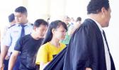 Ms. An Tran Thi follows defence counsel into the court room. 