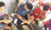 Weaving is one of the activities for the kids involved in the 2017 summer FIT program. Earlier this month, the group took a field trip to the TAOA center where they learned how to create items using dried leaves. [Courtesy photo]