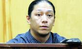 Lama Lauvao on the stand in court.