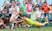 At the HSBC World Rugby Sevens Series XVIII in Hong Kong on April 8, 2017 Tom Bowen of England outruns Australian defender to score Englands second try.  Australia prevailed 12-10 to win Pool A with 9 points.   Australia will face Argentina in the Cup quarter finals.  England will play USA.