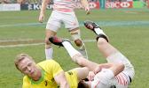 At the HSBC World Rugby Sevens Series XVIII in Hong Kong on April 8, 2017 Australia's Henry Hutchinson touches down against England to score Australia's first try.  Argentina beat England 12-10 to win Pool A.  Australia will play Argentina in the Cup quarter final.  England will play against USA.