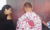 King Faipopo with his back to his supporters, seeks an explanation from his lawyer Josephine Sapolu