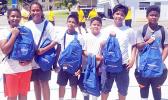 Meet the junior division champions of the first annual Manumalo Church Basketball Fellowship League: the white team, led by player coach Fitzgerald Alofa (3rd from right). The players received backpacks and school supplies provided by Papalii Laulii Alofa, who was also the head coach for the white team. See story for full details. [Courtesy photo]