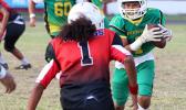 Misa Paiau of the JPS Lions is greeted by Vaouli of the JPS Vikings