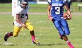 Player of the Game JV Jurgen Krusen, of Samoana High School storming towards the sidelines to take this one to the end zone – Krusen scored three touchdowns for Samoana in their 36 - 20 win over the Wildcats last Saturday. [photo: TG]