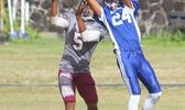 Sophomore cornerback for the Sharks, Elliot Lelei with the touchdown saving interception in the first half of their varsity game against the Warriors last Saturday morning.  [photo: TG]