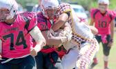 Vikings bruising running back muscling his way through midfield as a Warrior defender attempts to strip the football. [photo: TG]