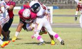 Two Warrior defenders taking down Faga’itua’s work horse T.I. Farani during the opening quarter of their Battle of the Toa’s varsity rival game last Saturday morning. Warriors are now No.1 in Varsity competition in ASHSAA Football League competition. [photo: TG]