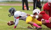 Iosefa Mauga of Nu’uuli gets tackled short of the first down marker in the second half of their JV match against the Vikings last Saturday, as the second game of the triple header for ASHSAA Football Week No. 9. [photo: TG]