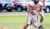 Tafuna Warriors Niles Tuamoheloa, storming towards the end zone to punch this one in for six in the opening half of their varsity game against Leone last Saturday.  [photo: TG]