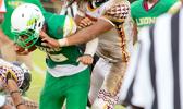 Leone’s new quarterback Ui’ese getting hammered by Penei Pavihi as Ui’ese finally gets acquainted with one of Tafuna’s finest, in the second half of their varsity game.  [photo: TG]
