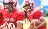 Faga’itua Vikings quarterback Fitu Amata behind his blockers