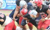 Samoana Sharks defensive captain, Masaichi Aviu breaks to the backfield and sacks Fitu Amata