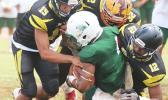 Leone Lions’ Joshua Taani being swallowed in the backfield by