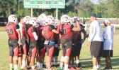 Coaches Jimmy Grey and Meafou Sagapolutele of the JPS Vikings speaking to their players
