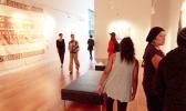 Viewers at the Women's Work exhibit. [courtesy photo via RNZI]