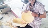 Andre Samoa with her kava bowls she carved