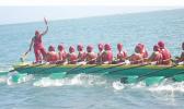Zita Martel captaining her longboat inside the reef in Samoa.